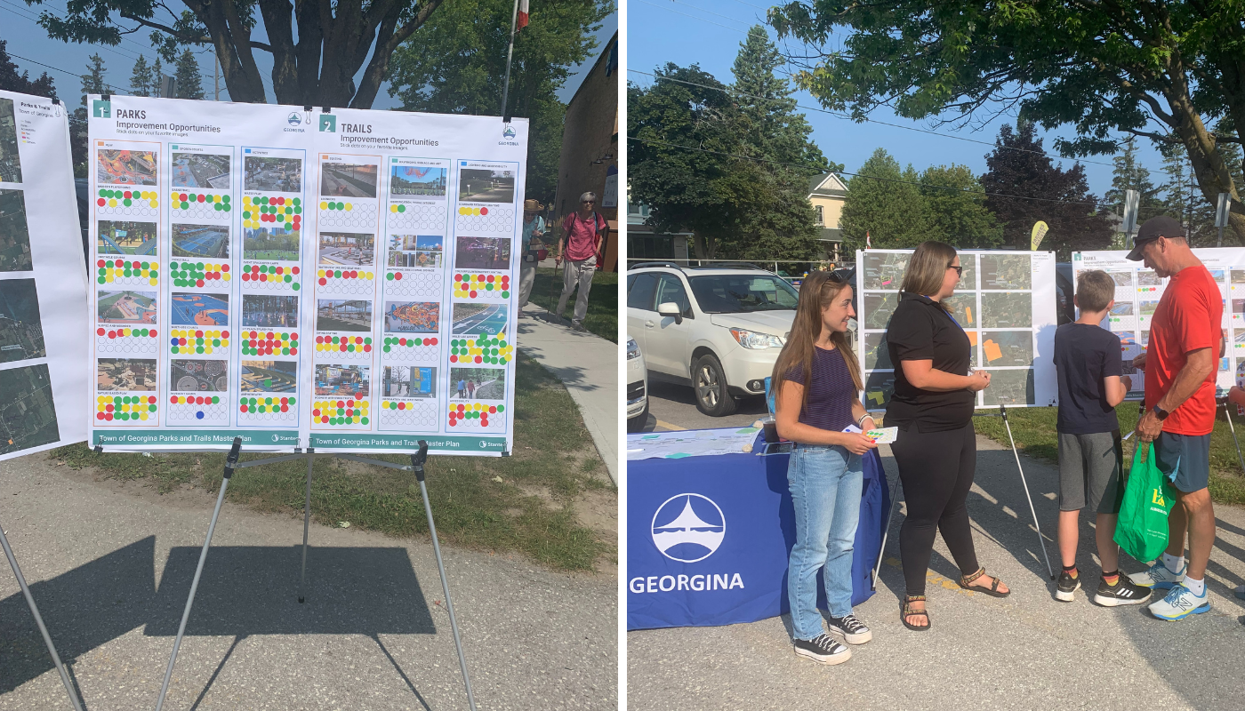 Two side-by-side photos from a community engagement event in Georgina. The left photo shows display boards with images and coloured sticker dots indicating public feedback on parks and trails improvement options. The right photo shows a Town of Georgina booth with staff and community members interacting; a man and two children place stickers on the feedback boards.